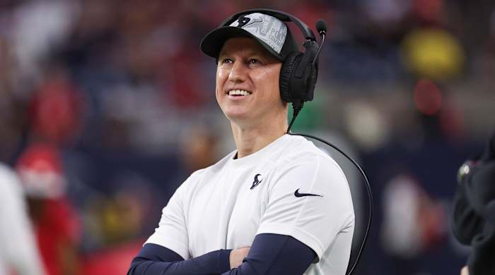 Texans offensive coordinator Bobby Slowik smiles